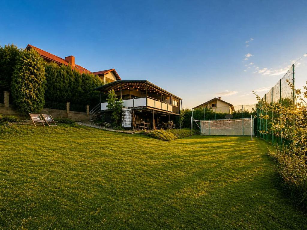 a house with a soccer field in the yard at Domek Panorama in Rymanów-Zdrój