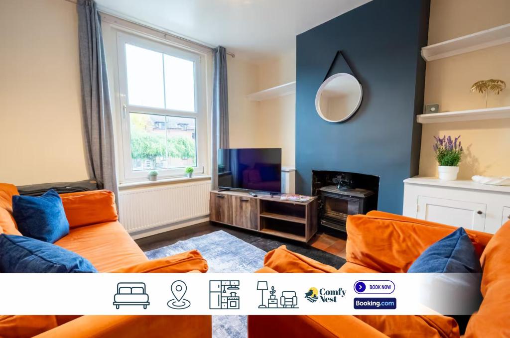 a living room with a couch and a tv at 3 BD 5 Beds WiFi in Wellingborough