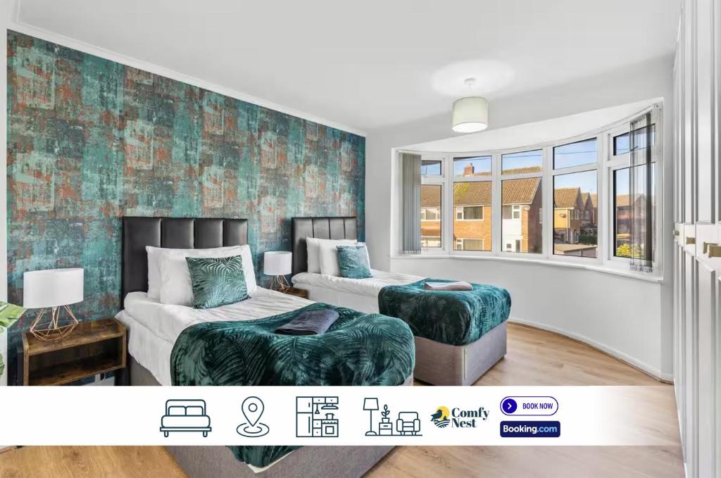 a bedroom with two beds and two ottomans at 5 BD Long Stays Parking in Stapleford