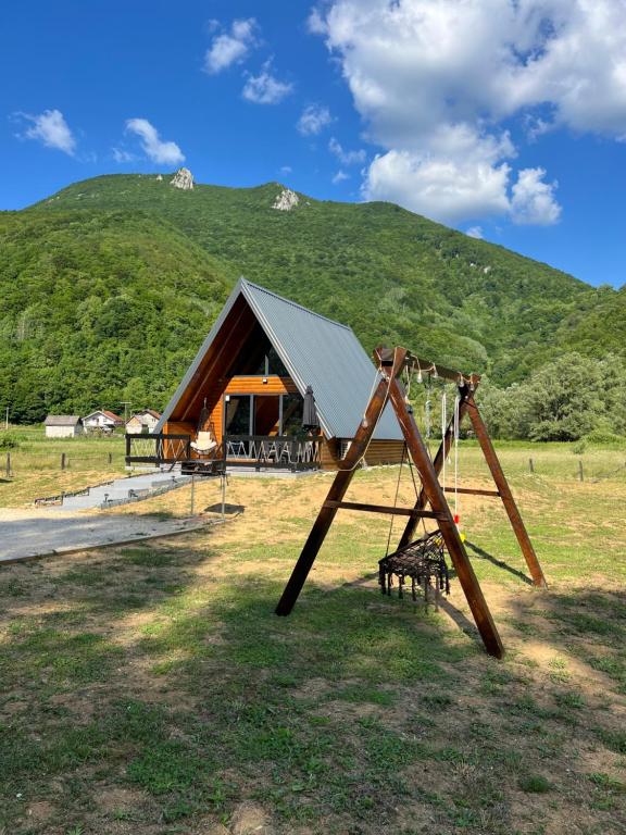 a swing set in front of a tent at Vila Jezero-Jajce in Jezero