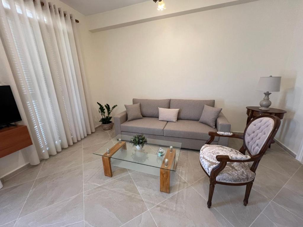 a living room with a couch and a chair at Orizon Sea View in Vathi