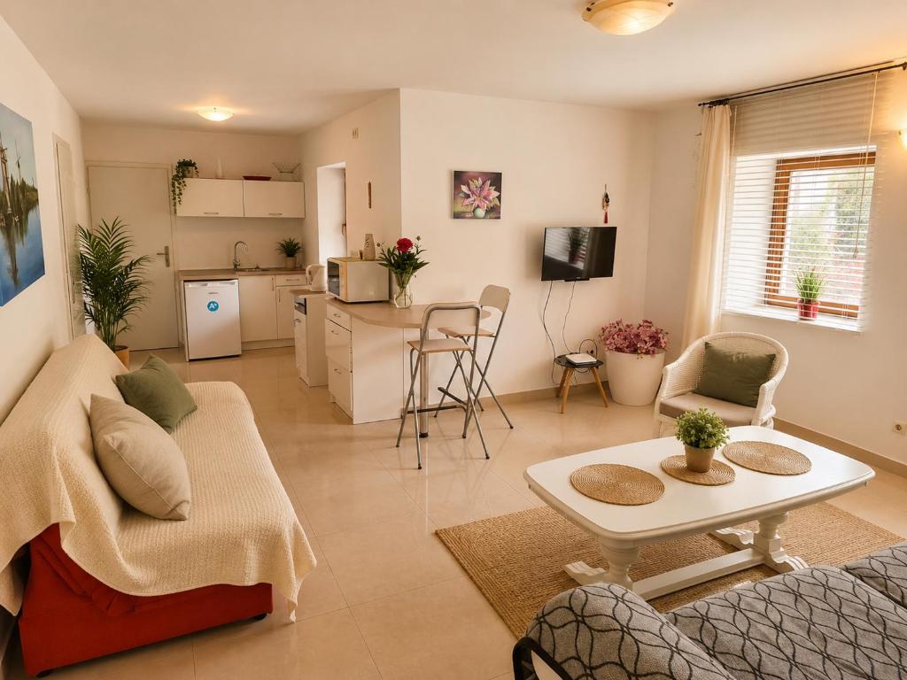 a living room with a couch and a table at Apartament4you - Szczycionek in Korpele
