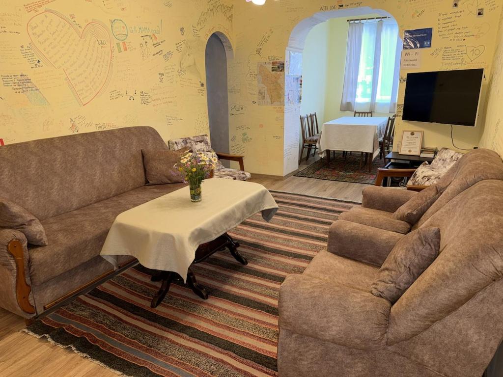 a living room with a couch and two chairs and a table at Aregak B&B and Tours in Goris