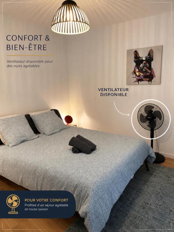 a bedroom with a bed with a black bag on it at Les Studios de Clément in Poitiers