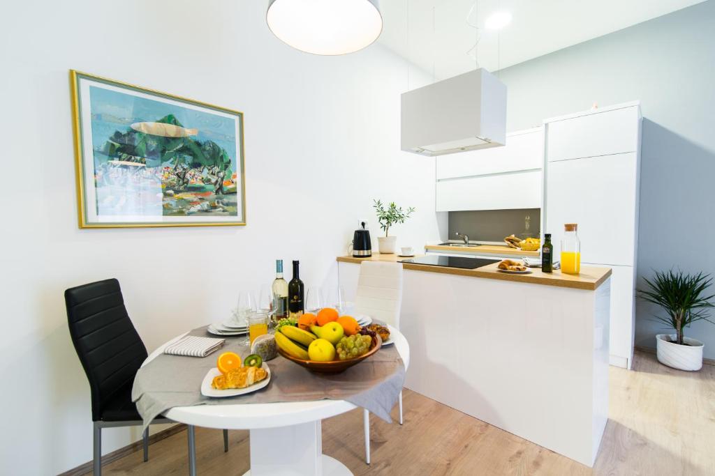 Kuchyň nebo kuchyňský kout v ubytování Polai Center Apartments