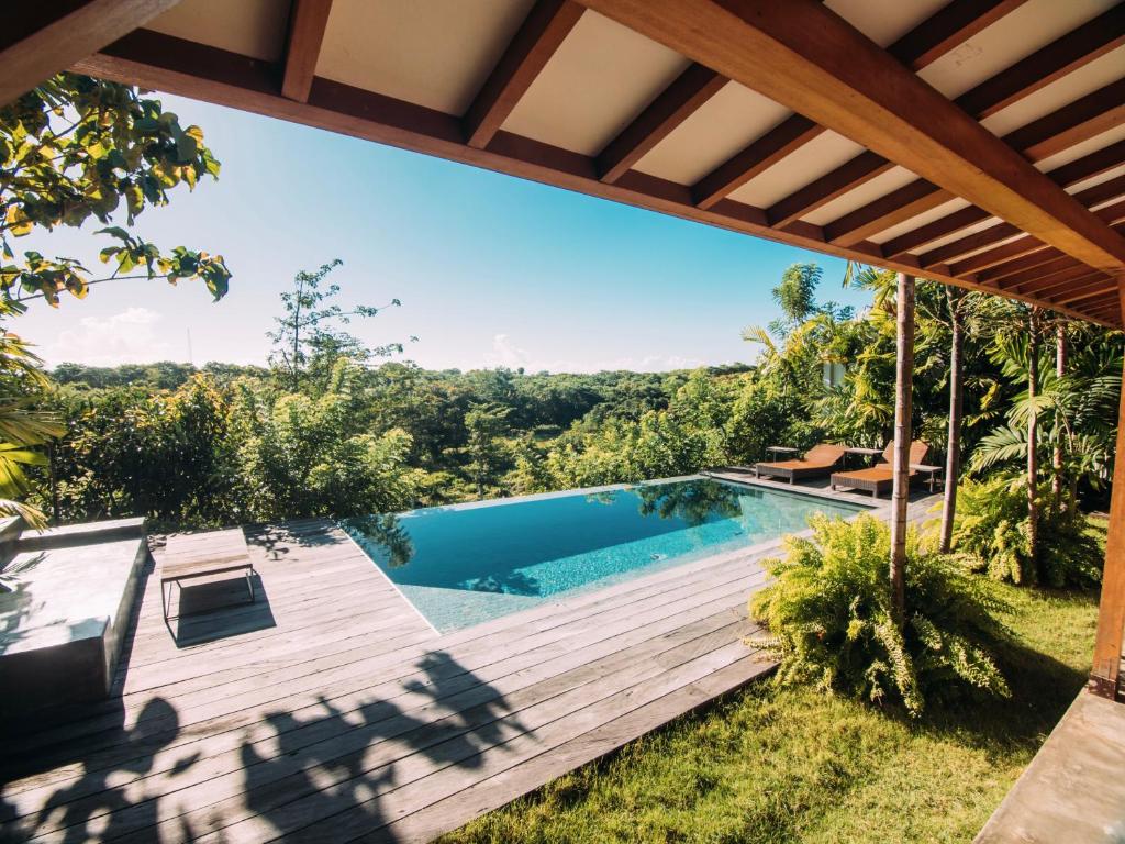 an image of a swimming pool in a house at Villa YAMI Uluwatu Private Infinity Pool Jungle Views in Ungasan