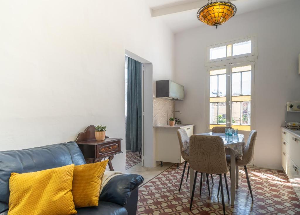 a living room with a couch and a table at 458 - Favlyn Boutique Apartments in Sliema