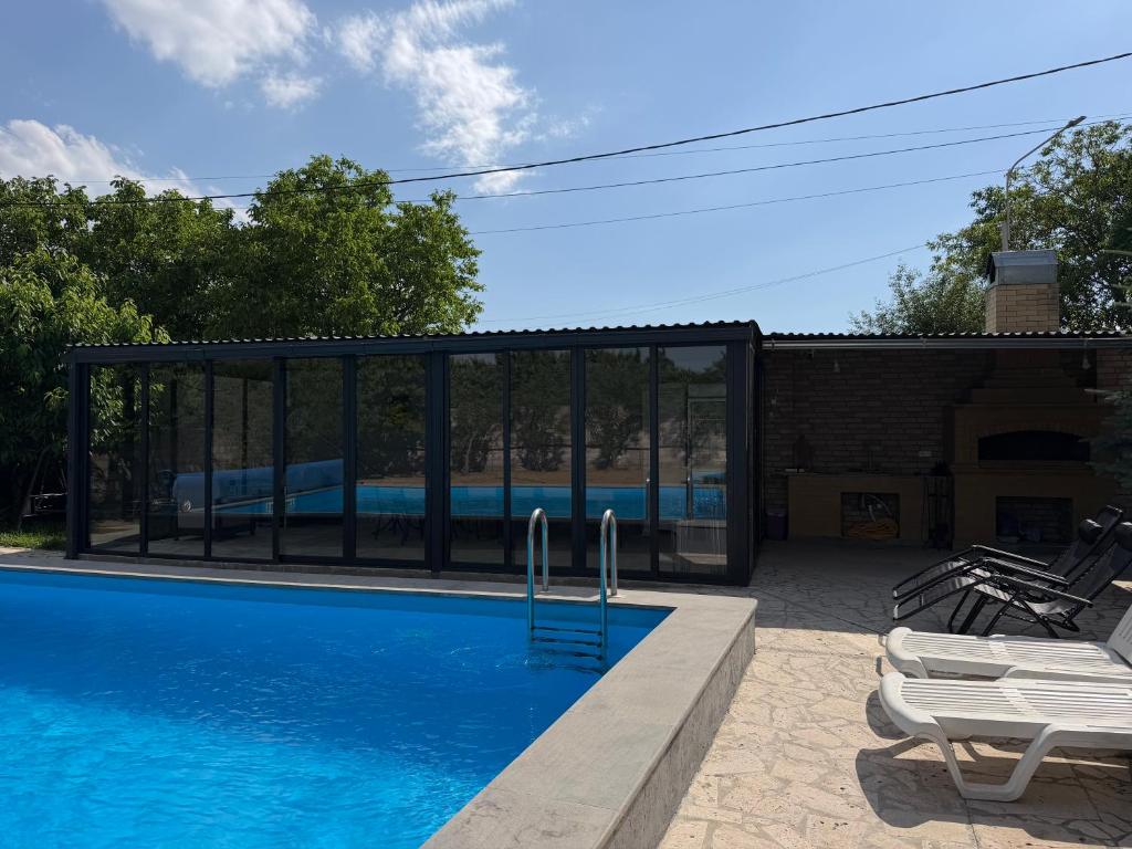 a swimming pool with a train in the background at Blue Garden in Nor Hachyn