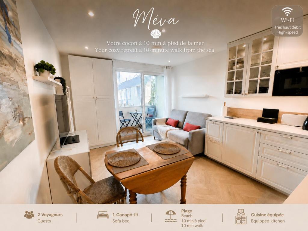 a kitchen and living room with a table and chairs at Méva in Courseulles-sur-Mer