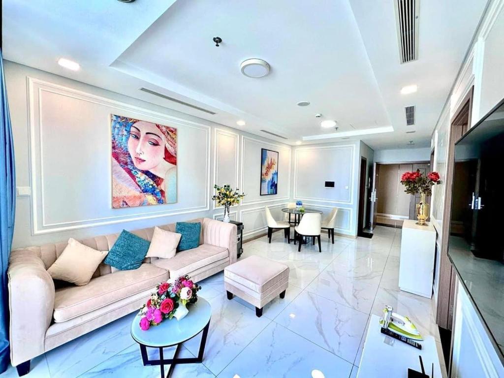 a living room with a couch and a table at The Fermin Premium Studios in Ho Chi Minh City