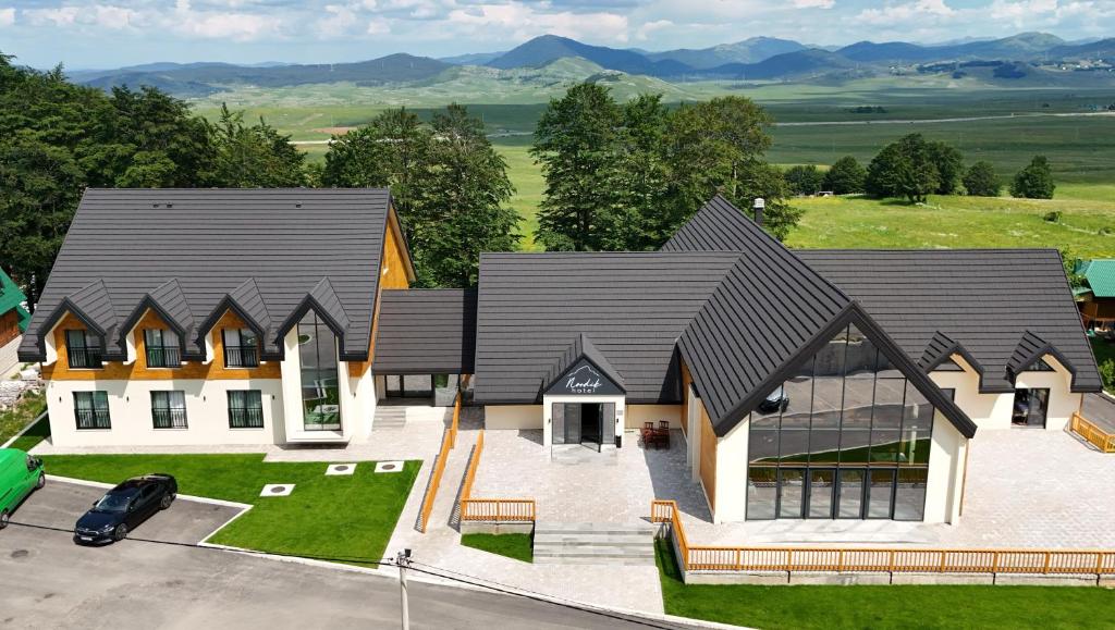 an aerial view of a house with a garage at Hotel Nordik in Žabljak