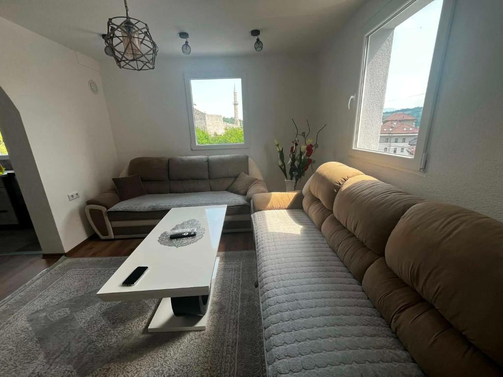 a living room with a couch and a coffee table at Apartman Kastel in Travnik
