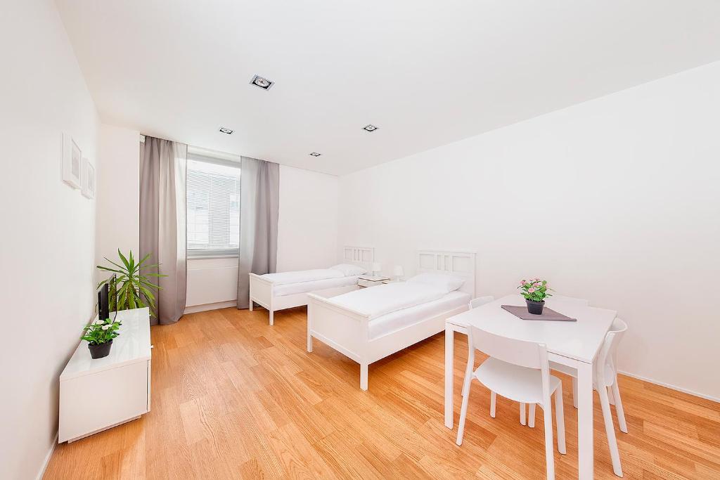 Postel nebo postele na pokoji v ubytování Hotel & Hostel Letov
