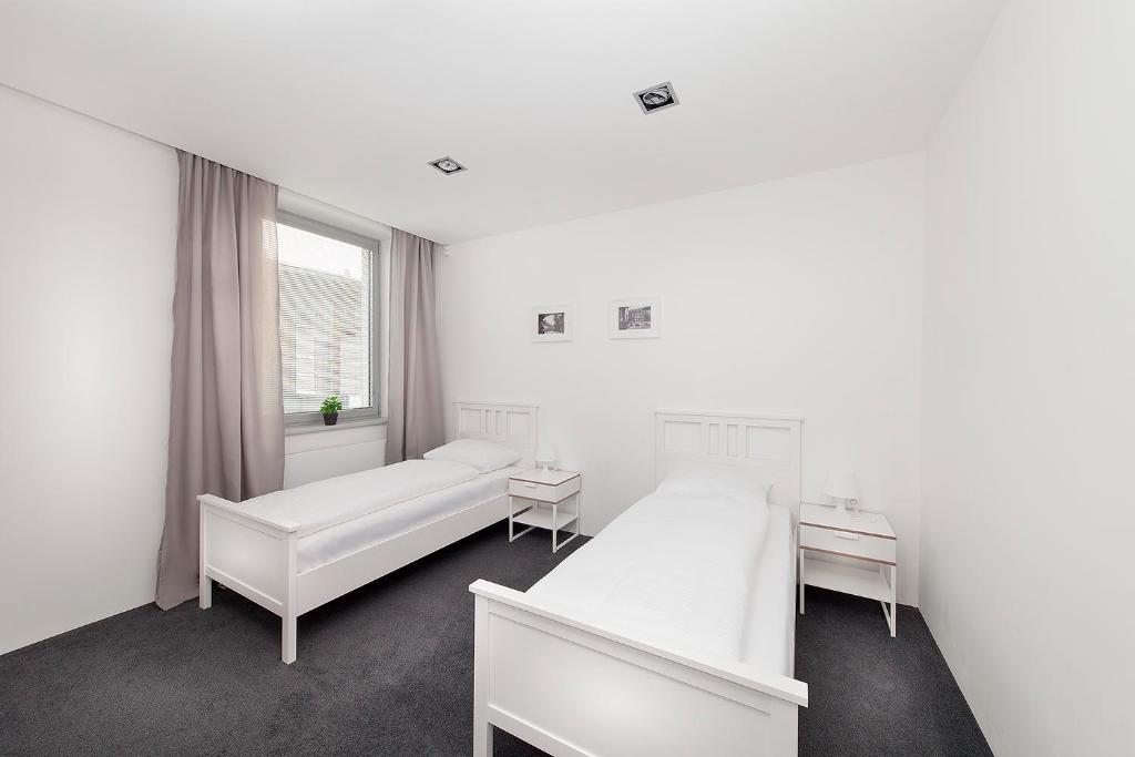 Postel nebo postele na pokoji v ubytování Hotel & Hostel Letov