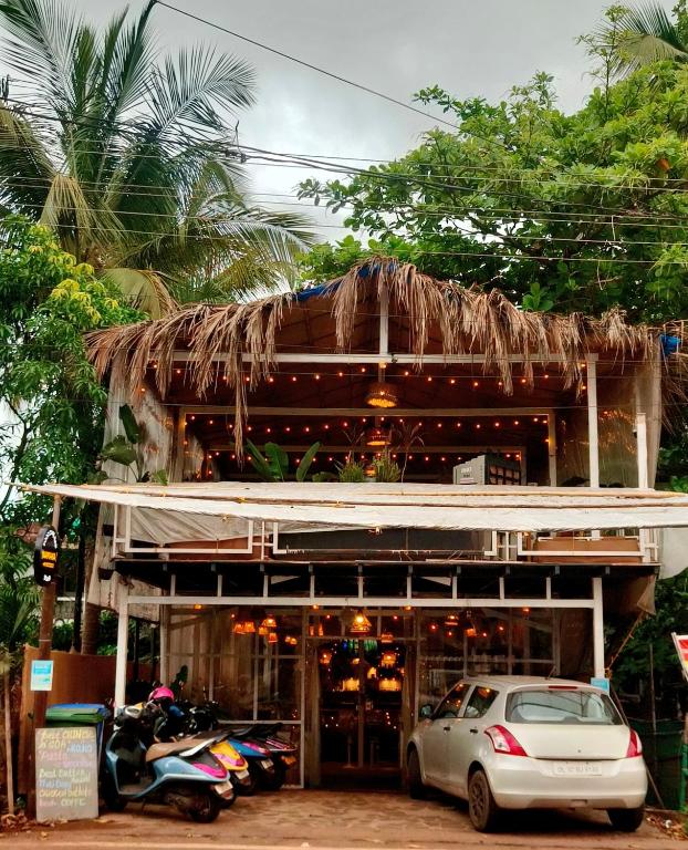 a car parked in front of a building at NAMAKA, Morjim and Ashwem Beach 300m away in Morjim