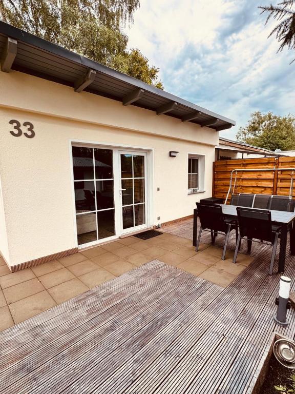 a house with a deck with a piano on it at Joachims Ruhe in Joachimsthal