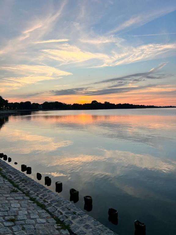 a view of a body of water at sunset at Apartment Altstadt Stralsund in Stralsund