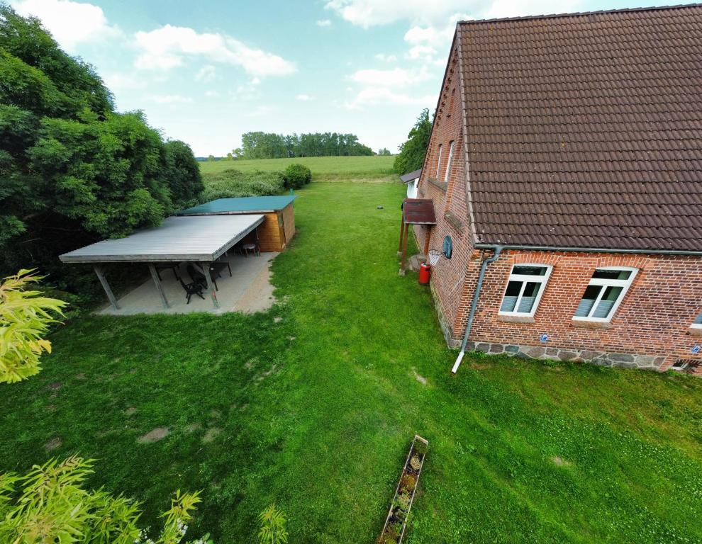 an overhead view of a house with a large roof at Ferienhaus Brudersdorf in Dargun