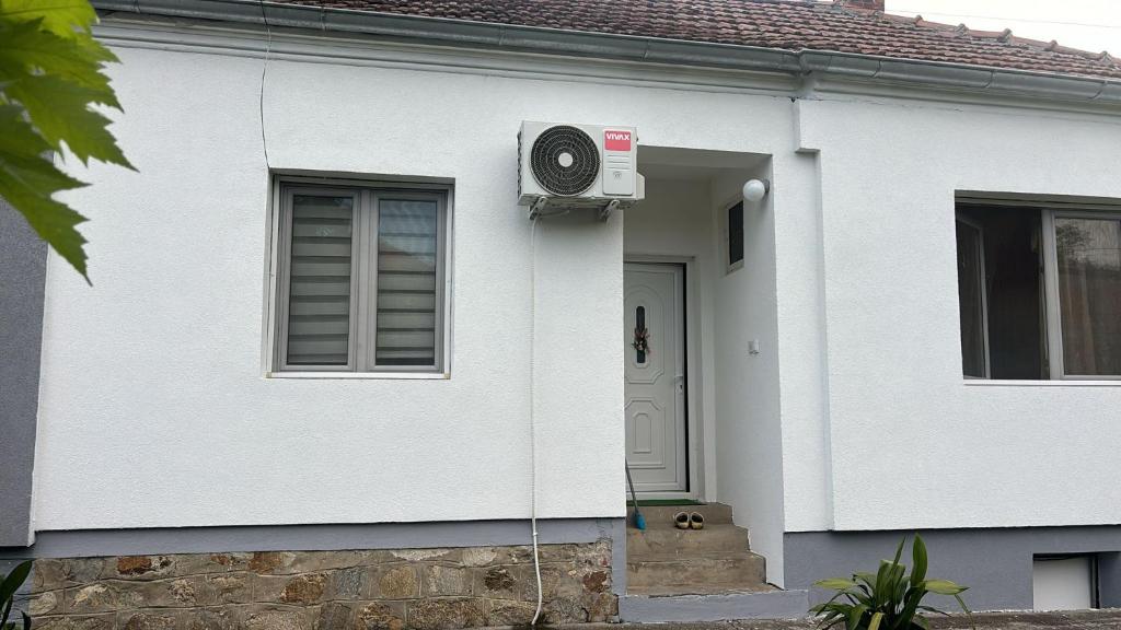 a white house with a speaker on the side of it at Sweet home Jagodina in Jagodina