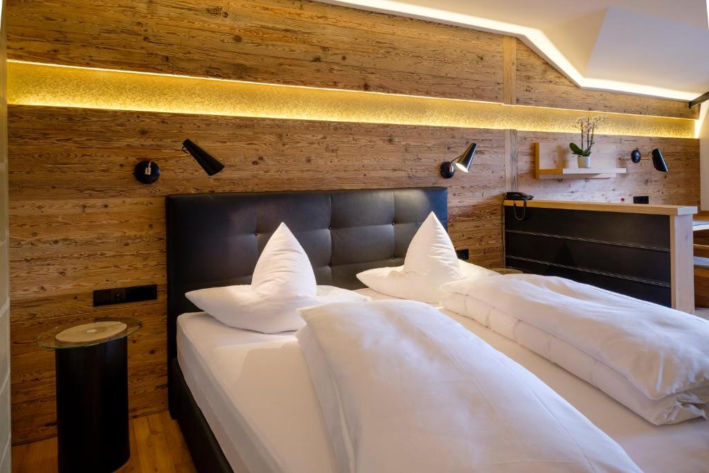 Ein Bett oder Betten in einem Zimmer der Unterkunft Boutique Hotel Gams