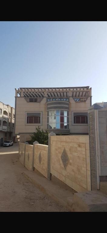 a building with a fence in front of it at Ajdir in Ajdir