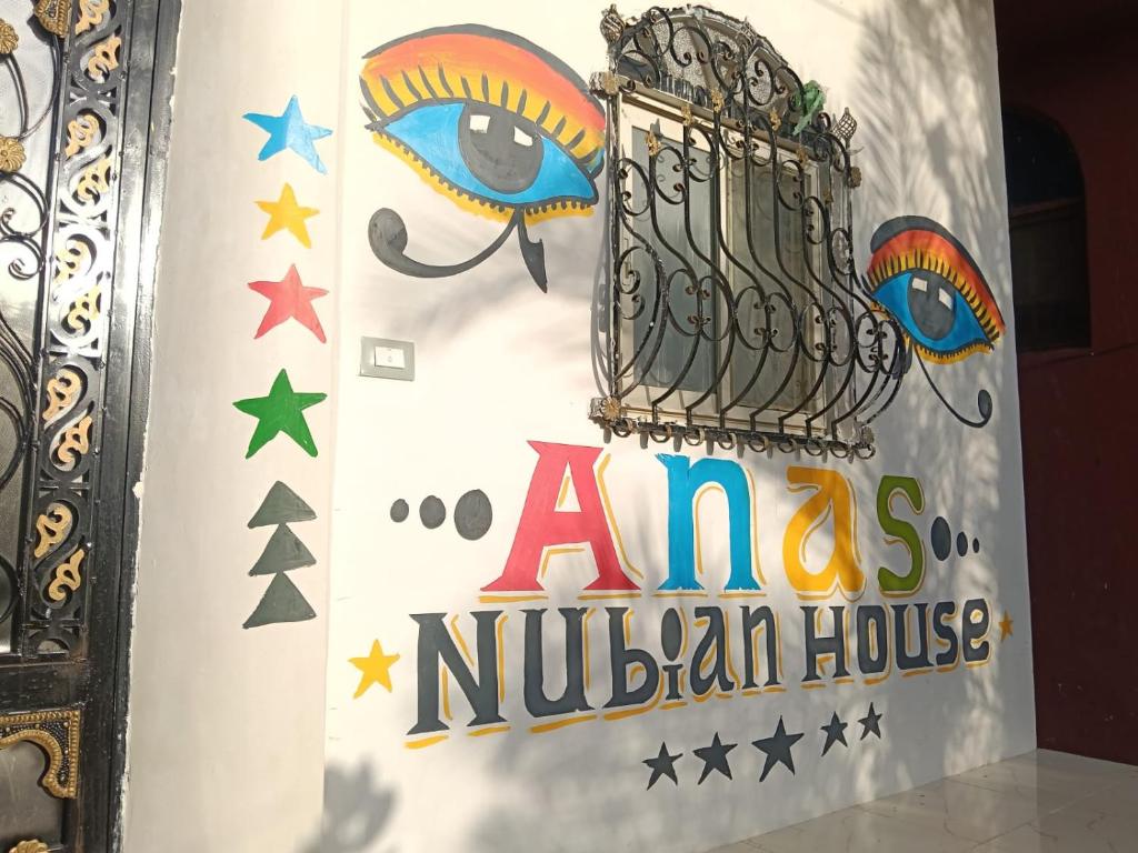 a sign for an amazon nucillian house at Anas Nubian Guest House in Aswan