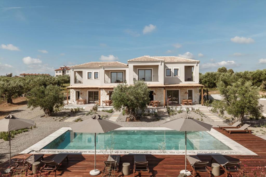 an image of a house with a swimming pool at Levante Afitos Suites - Adults Only in Afitos