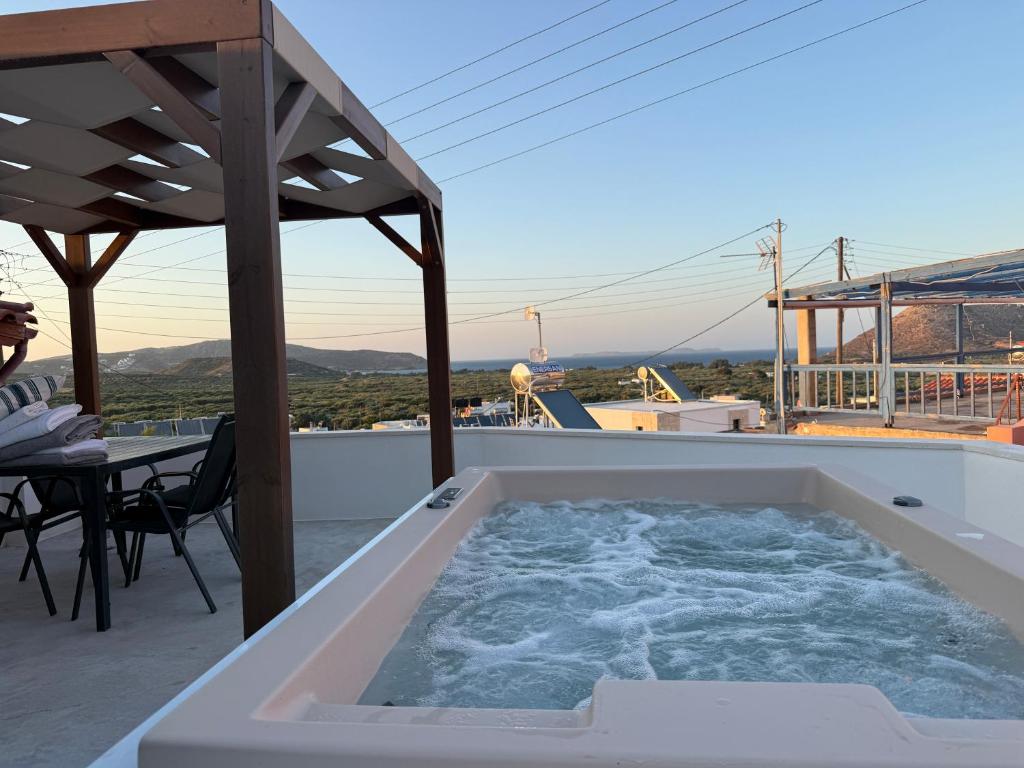 a hot tub on the roof of a house at Kalithea Chorio 1 in Palekastron