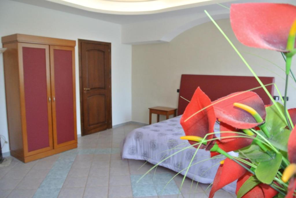 Łóżko lub łóżka w pokoju w obiekcie Hotel Stefano a Melito