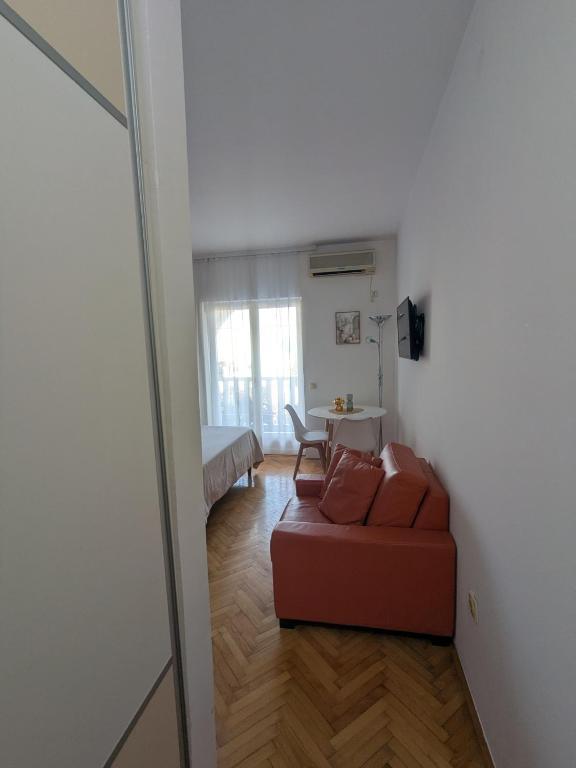 a living room with a couch and a table at Azzurro in Igalo