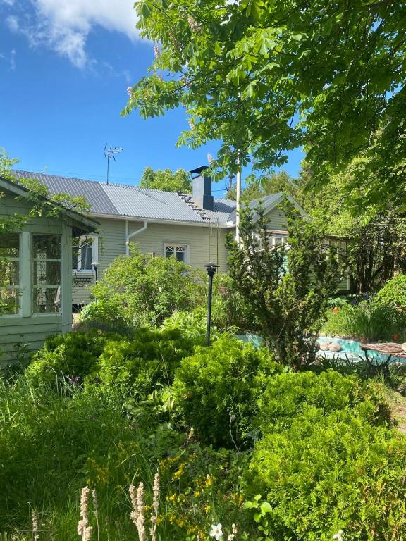 a garden in front of a house at Villa Tapiola in Lohja