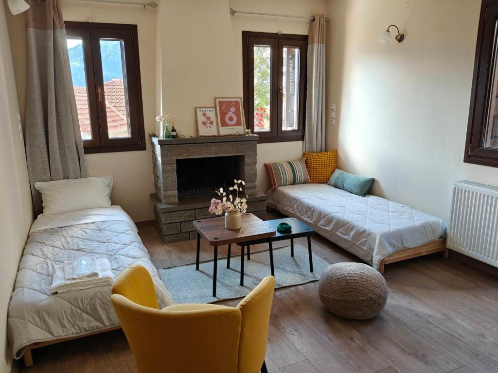 a living room with a bed and a couch at Metsovo Fireplace Retreat I in Metsovo