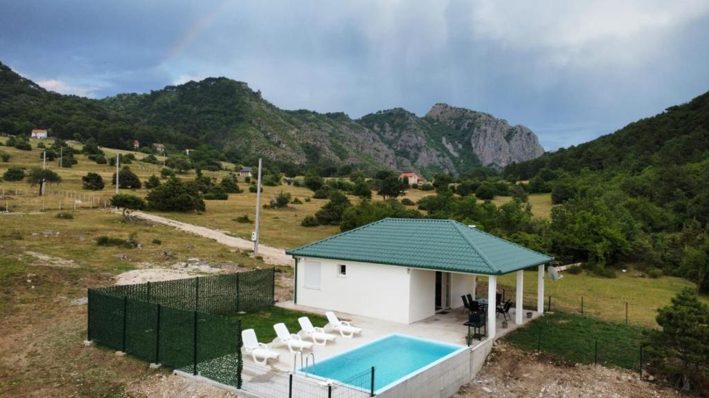 an aerial view of a house with a swimming pool at Vila Lana in Trebinje