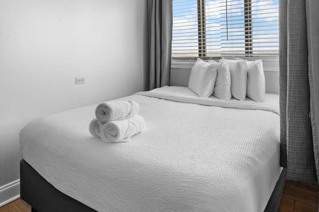 a bedroom with a bed with towels on it at The Palace 2306 in Myrtle Beach