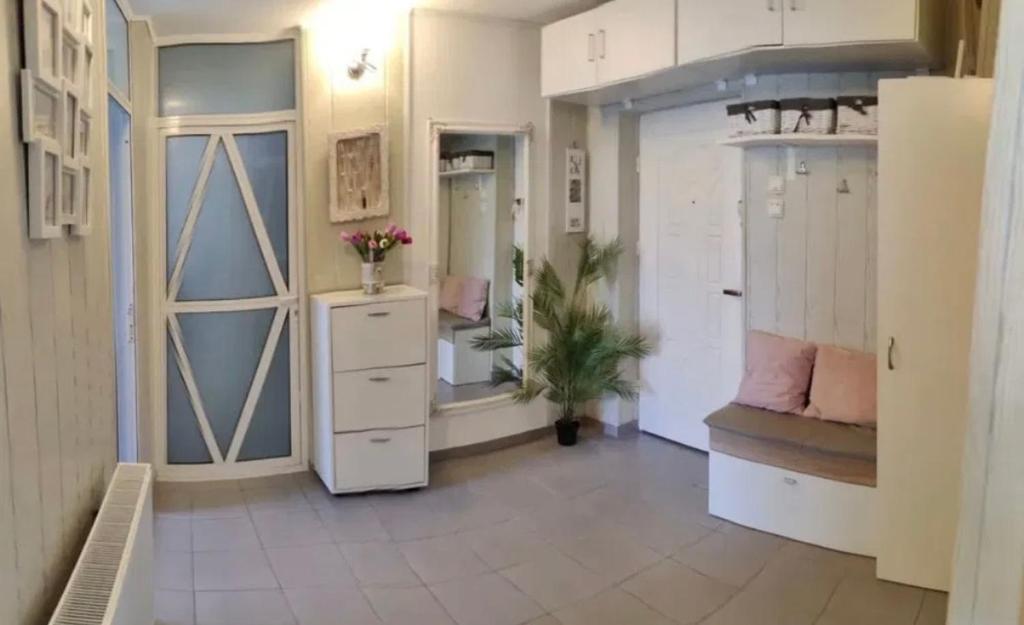 a large room with a dressing room with a closet at Saturn Cozy Stay in Mangalia