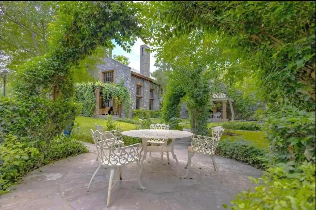 a table and chairs in front of a house at By Lumina Parvasa 1 in Ejido Parras