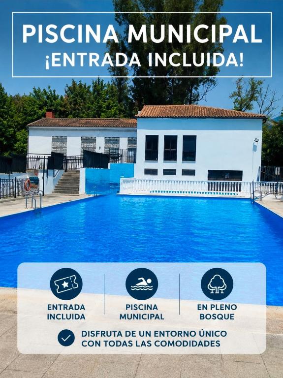 a sign in front of a swimming pool in front of a building at Casa Los Soles in El Bosque