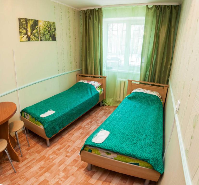 Ліжко або ліжка в номері Apartment Sevastopolskaya 17