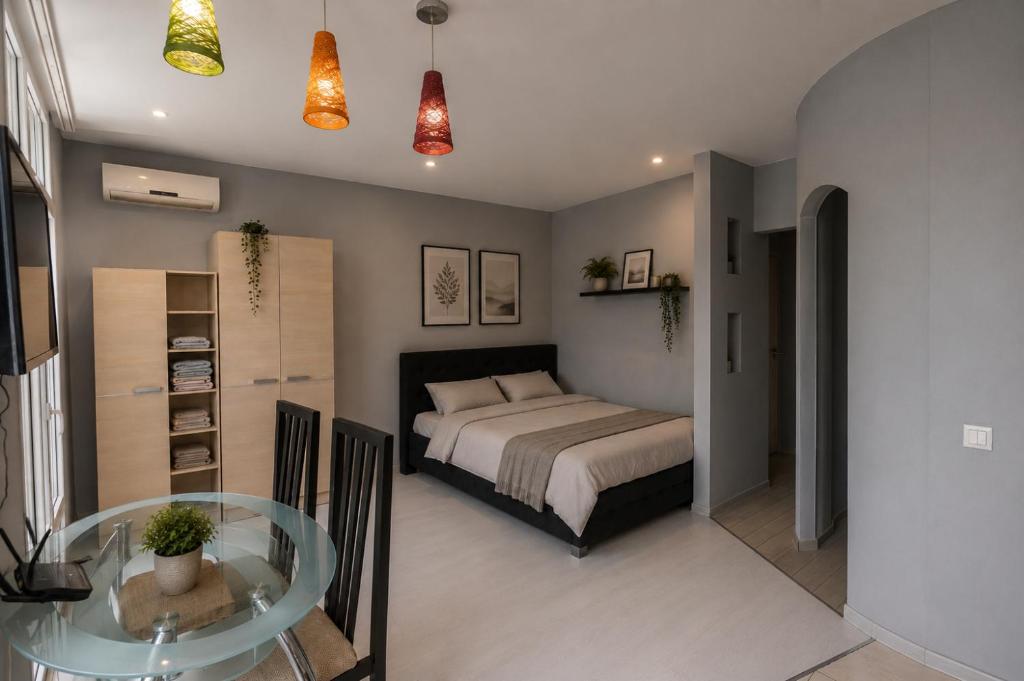 a bedroom with a bed and a glass table at Columna Residence in Chişinău