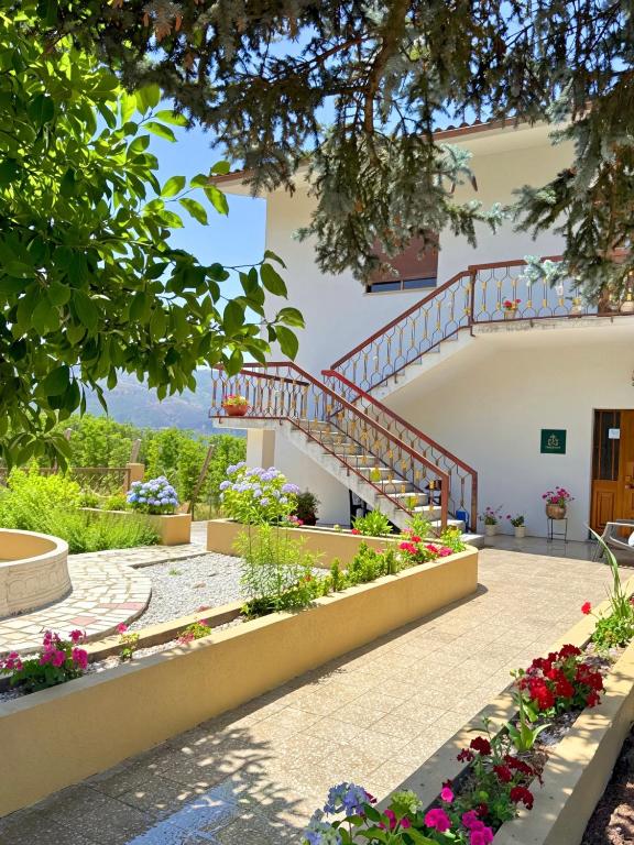 a building with a staircase and flowers at Casa Vicente in Lamego