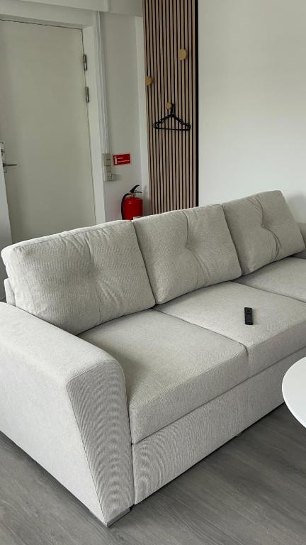 a white couch sitting in a living room at Ilulissat City Apartments- Apartment 2 in Ilulissat