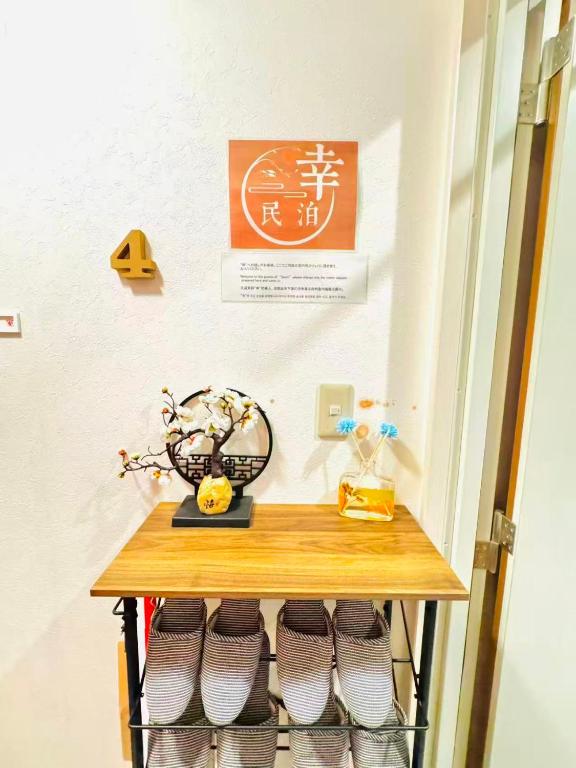 a shelf with some shoes on it in a room at 幸 in Osaka
