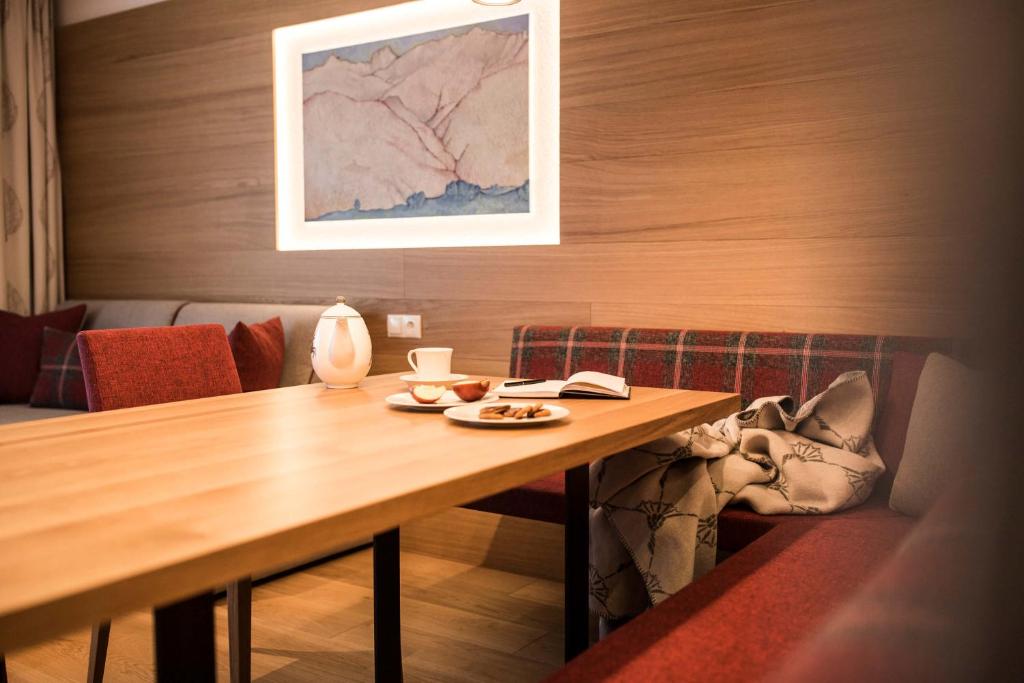 Posedenie v ubytovaní Slow Living Suite - Ferienwohnung mit privater Sauna & Garten