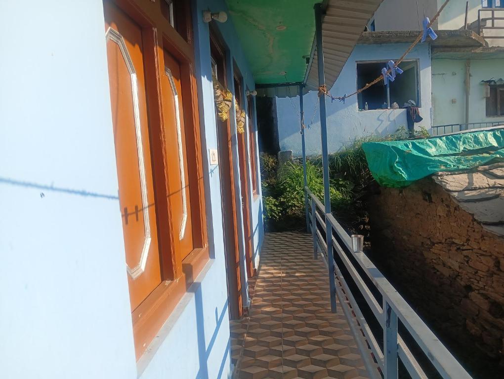 a hallway of a building with orange windows at Anik home stay in Sari