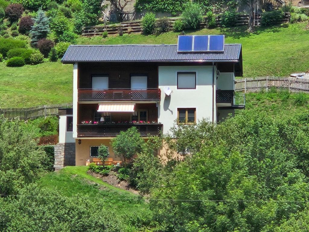 a house with a solar panel on top of it at Mirnockblick Apartments 2 in Radenthein