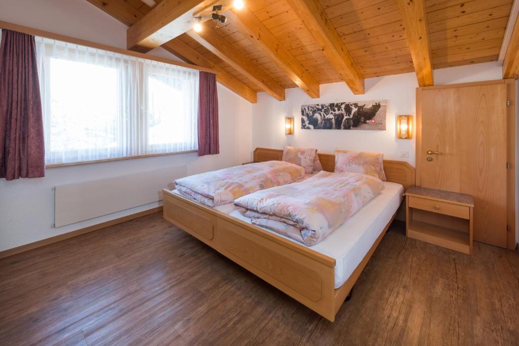 Postel nebo postele na pokoji v ubytování Helvetia Apartments