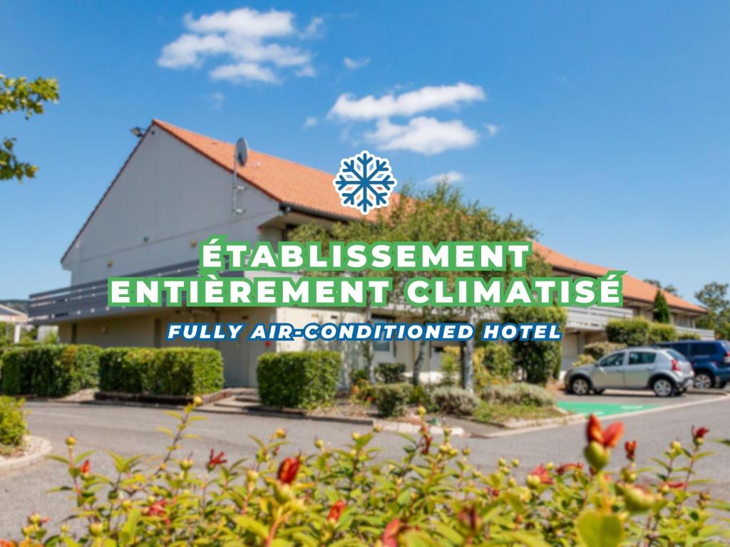 a sign for the entrance to a hotel at Campanile Millau in Millau