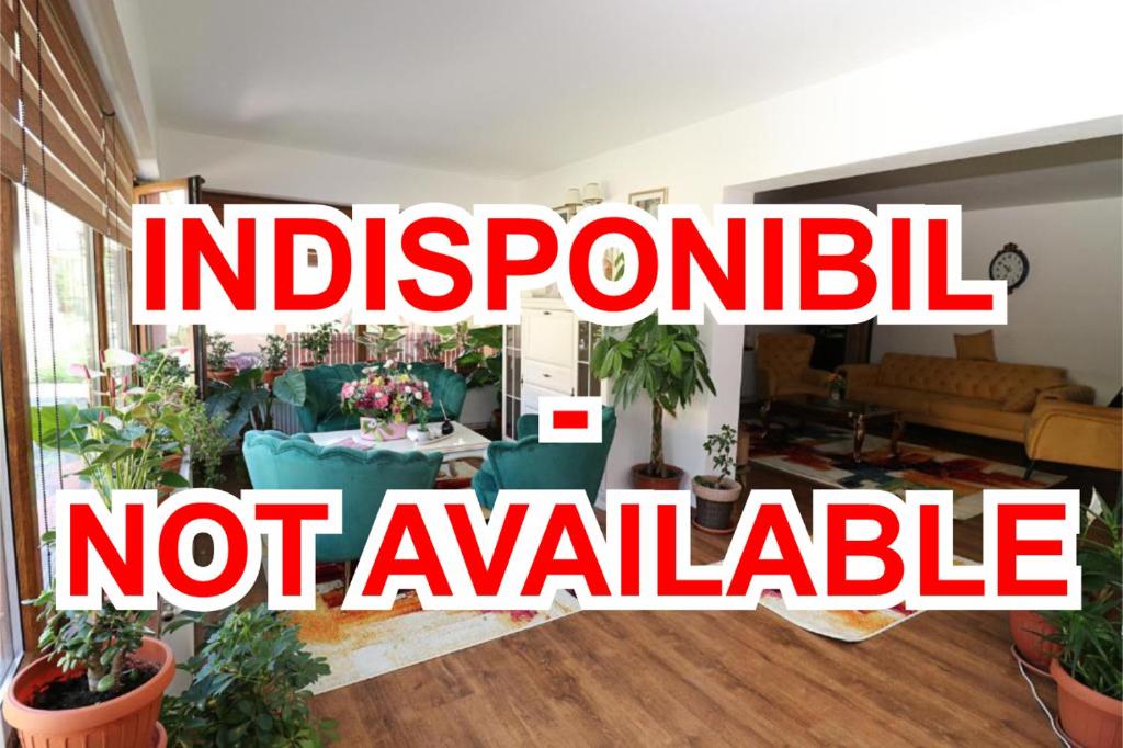 a sign that reads independent not available in a living room at GreenMoodHouse in Comăneşti