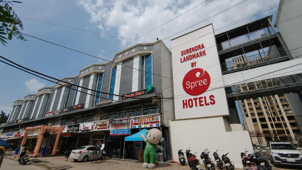 a building with a stop sign on the side of it at Surendra Landmark By Spree Hotels Bhopal in Bhopal
