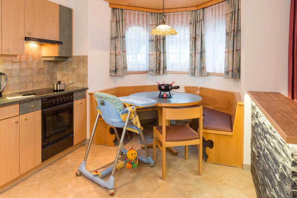 Kuchyň nebo kuchyňský kout v ubytování Helvetia Apartments